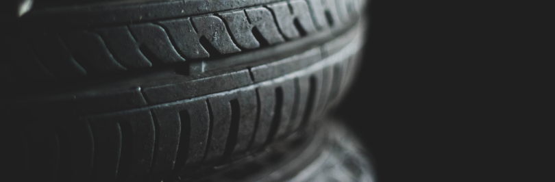 close-up-tire-tread-against-black-background
