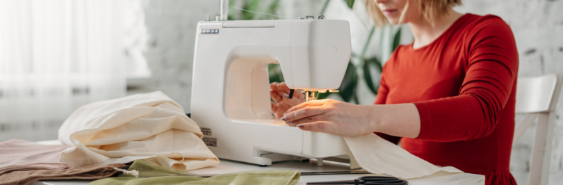 woman-sewing-while-sitting-on-chair