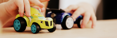 child-playing-with-car-plastic-toys