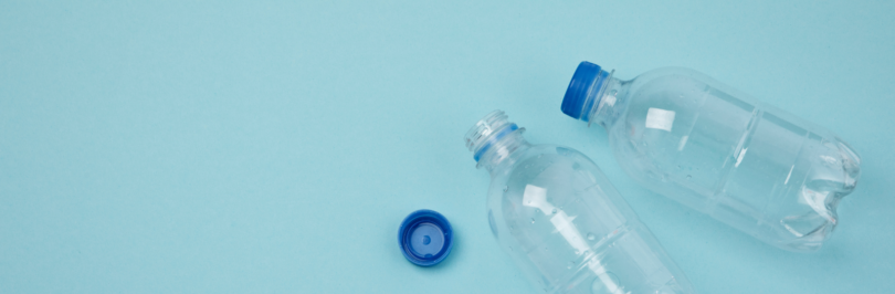 flat-lay-plastic-bottles-blue-background