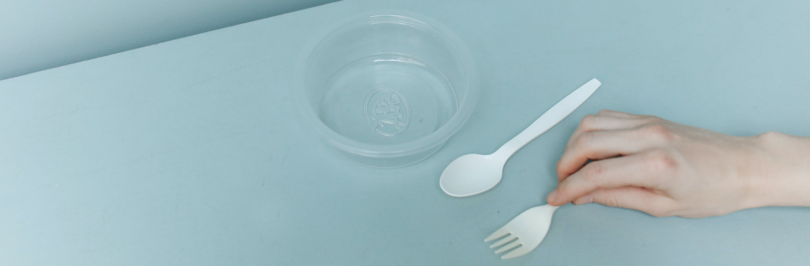 hand-holding-white-plastic-fork
