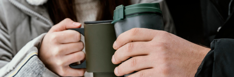 people-cheers-with-travel-mugs