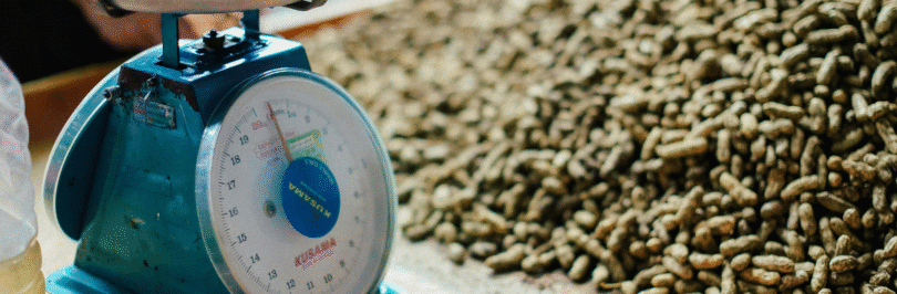Old fashioned scale and a pile of nuts