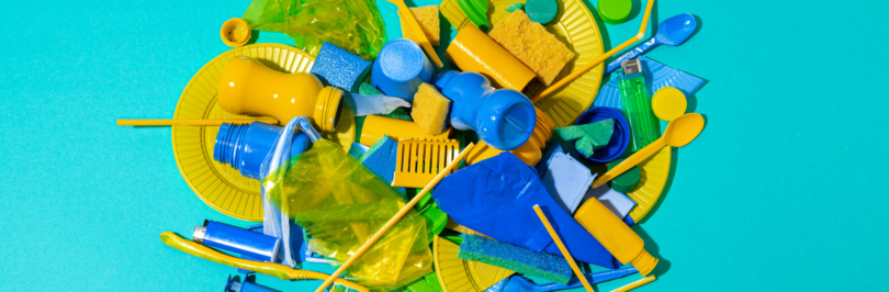 yellow, blue, and lemon-green plastic on a bright blue background