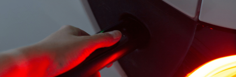 Electric vehicle being charged