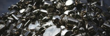 Piler of loose steel pieces on a black table
