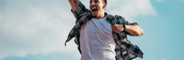 man in a t-shirt and shorts jumping in the air