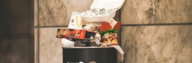 Overflowing outdoor garbage bin