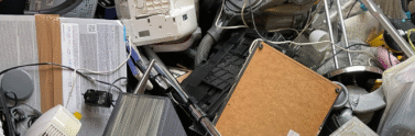 discarded electronics in a bin