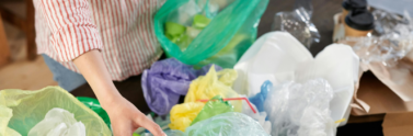 Peson sorting through plastic bags