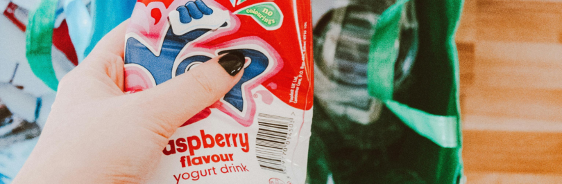 hand holding empty plastic bottle