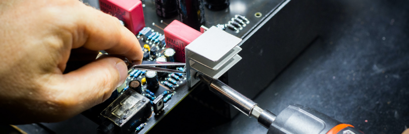 Person dismantling circuit board