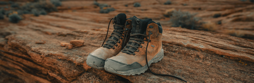 pair of hiking shoes on trail