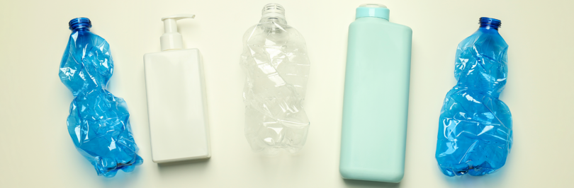 assorted plastic bottles and containers on white background