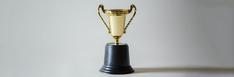 Gold trophy on white background