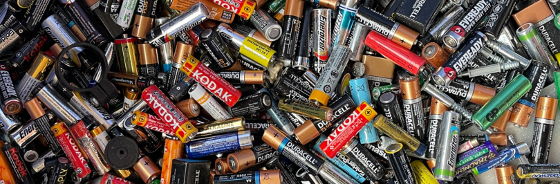 Assorted spent batteries in a pile