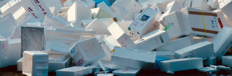 Discarded polystyrene containers piled up