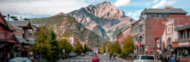 Mountain range and city street in Banff, Alberta