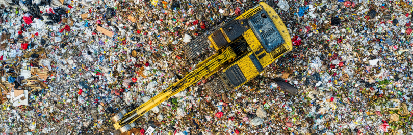 Birds eye view of excavator in landfill