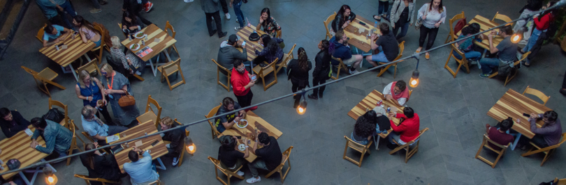 Birds eye view of people dining in mall food court