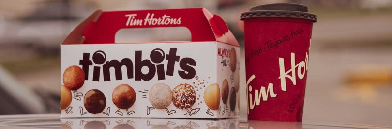 photo of a box of Tim Hortons timbits and a cup of Tim Hortons coffee