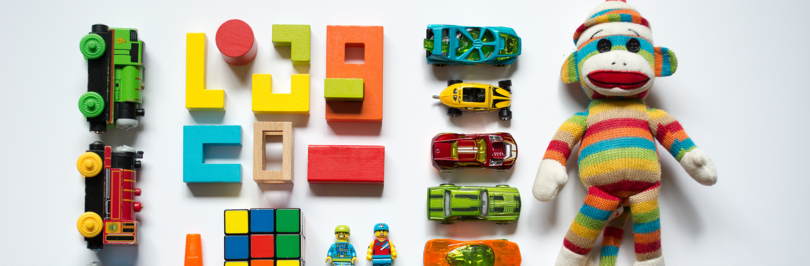 Colourful assorted children's toys on white table