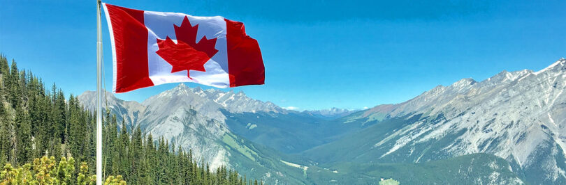 Canadian flag in the mountains