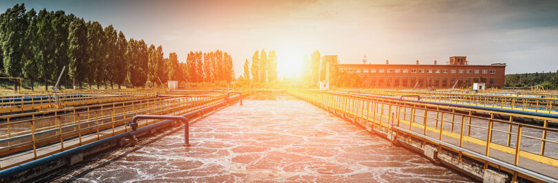 photo of wastewater treatment plant at sunset