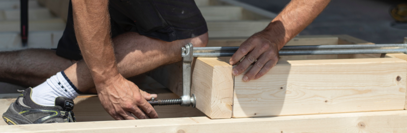 Carpenter installing wooden structure